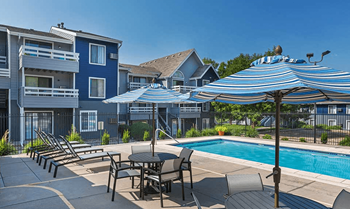 Poolside Dining Tables at Windmill Apartments, Colorado Springs, CO, 80916